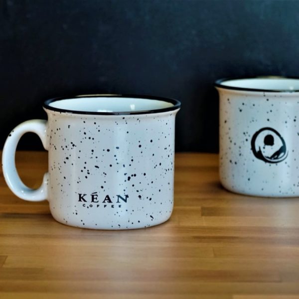 White ceramic camper mug with Kéan Coffee Logo showing both sides